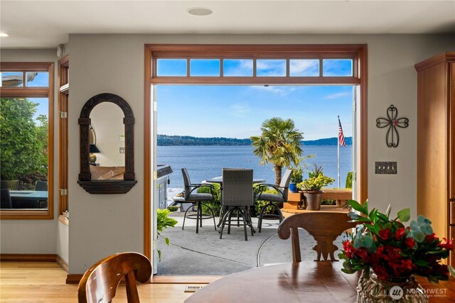 17834 SE 40th Pl, Bellevue, WA 98008 - dining area with a water view, healthy amount of natural light, wood finished floors, and recessed lighting