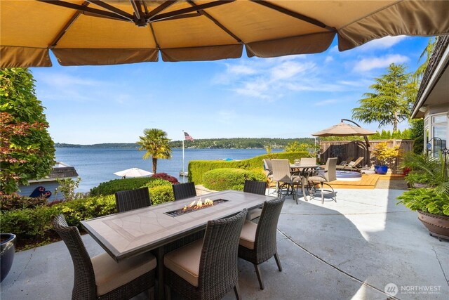 17834 SE 40th Pl, Bellevue, WA 98008 - view of patio / terrace featuring outdoor dining area, an outdoor fire pit, and a water view