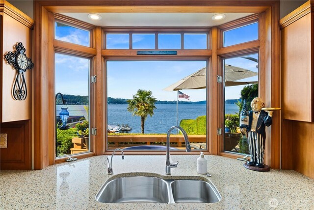 17834 SE 40th Pl, Bellevue, WA 98008 - kitchen featuring a sink, a water view, and light stone countertops