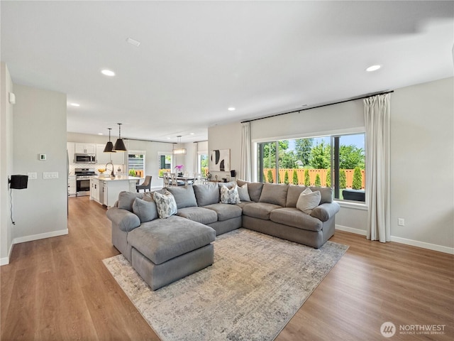208 Hovey St, Buckley, WA 98321 - living room featuring recessed lighting, baseboards, and light wood-type flooring