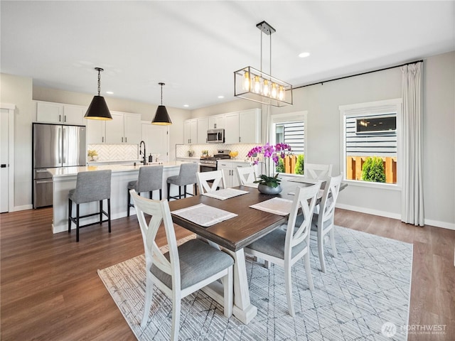 208 Hovey St, Buckley, WA 98321 - dining space with wood finished floors, recessed lighting, and baseboards