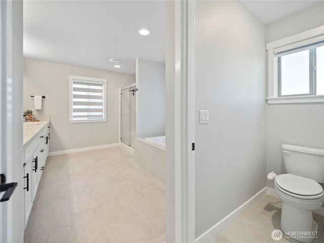208 Hovey St, Buckley, WA 98321 - full bathroom with healthy amount of natural light, a bath, a shower stall, vanity, and recessed lighting