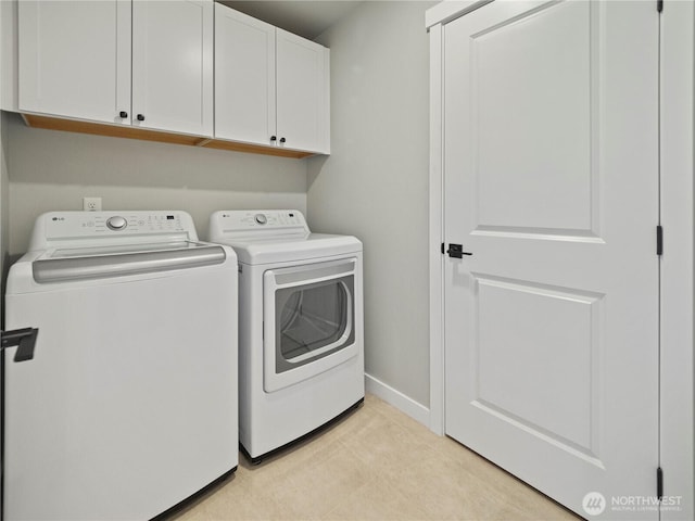 208 Hovey St, Buckley, WA 98321 - laundry area with cabinet space, separate washer and dryer, baseboards, and light tile patterned floors