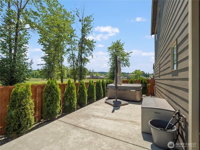 208 Hovey St, Buckley, WA 98321 - fenced backyard with a hot tub and a patio area