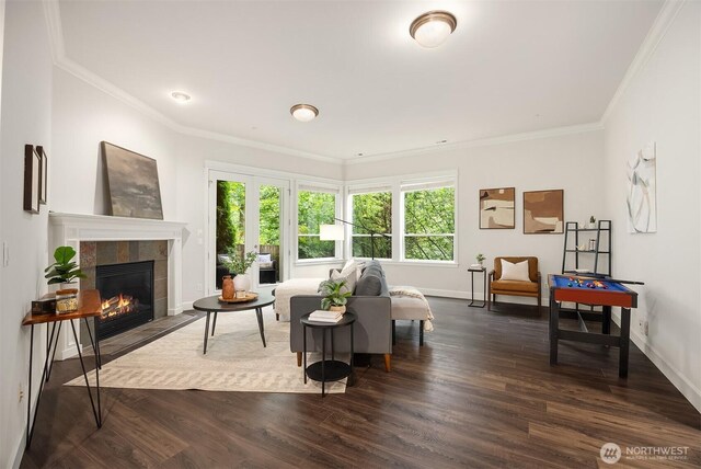 11005 NE 100th Pl, Kirkland, WA 98033 - living area with ornamental molding, a tile fireplace, dark wood finished floors, and baseboards