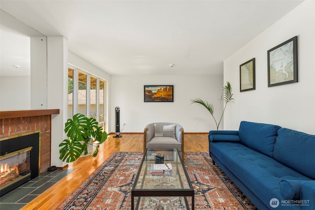 1981 Sequoia St SE, Port Orchard, WA 98366 - living room featuring a fireplace, wood finished floors, and baseboards