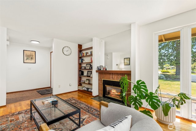 1981 Sequoia St SE, Port Orchard, WA 98366 - living area with a brick fireplace and wood finished floors
