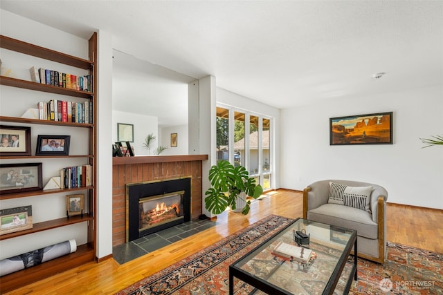 1981 Sequoia St SE, Port Orchard, WA 98366 - living area with a brick fireplace and wood finished floors