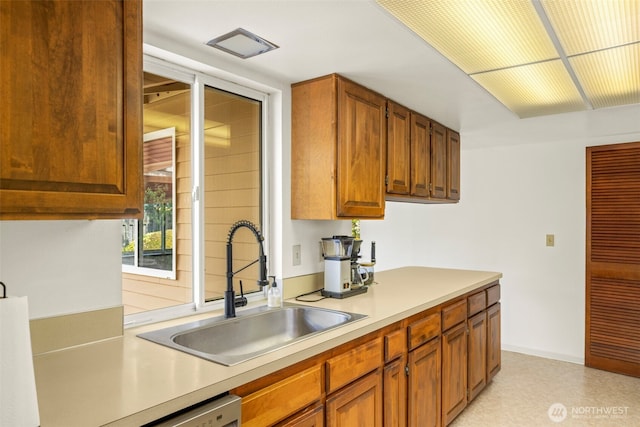 1981 Sequoia St SE, Port Orchard, WA 98366 - kitchen with a sink, light countertops, and brown cabinets