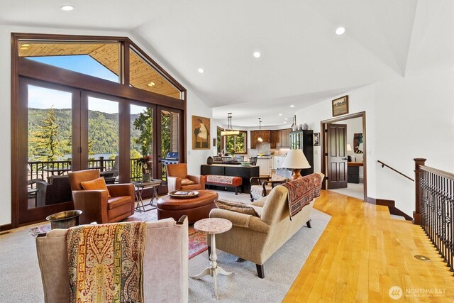 20 Longshore Ln, Bellingham, WA 98229 - living room featuring recessed lighting, high vaulted ceiling, light wood-style flooring, baseboards, and french doors