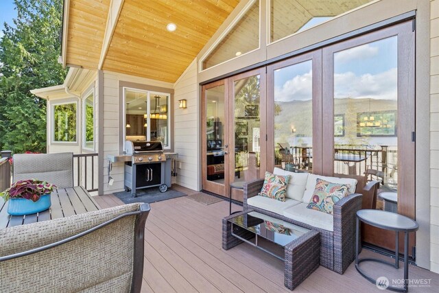 20 Longshore Ln, Bellingham, WA 98229 - wooden deck with area for grilling, outdoor lounge area, and french doors