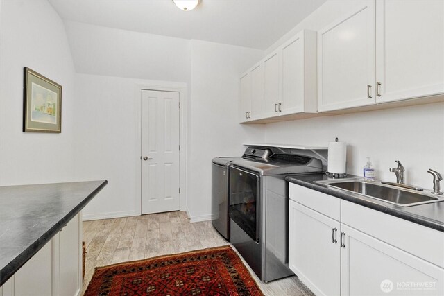 20 Longshore Ln, Bellingham, WA 98229 - laundry room with washer and dryer, light wood-style flooring, cabinet space, and baseboards