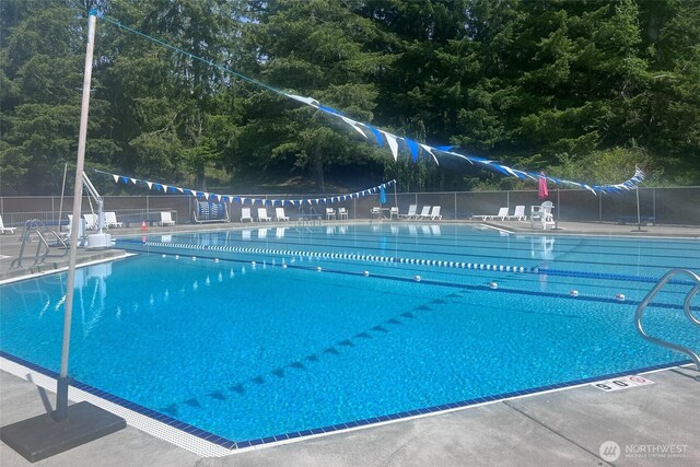 20 Longshore Ln, Bellingham, WA 98229 - community pool with a forest view and a patio area