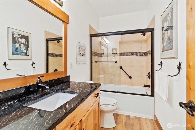 20 Longshore Ln, Bellingham, WA 98229 - bathroom with toilet, vanity, combined bath / shower with glass door, and wood finished floors