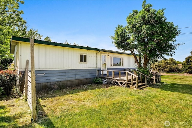 338 Potato Hill Rd NE, Moses Lake, WA 98837 - rear view of house with a wooden deck and a yard