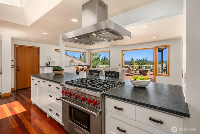 7440 SE 32nd St, Mercer Island, WA 98040 - kitchen with luxury stove, island exhaust hood, dark wood-style flooring, white cabinetry, and recessed lighting