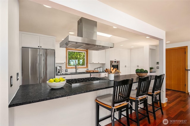 7440 SE 32nd St, Mercer Island, WA 98040 - kitchen featuring appliances with stainless steel finishes, wall chimney exhaust hood, white cabinetry, backsplash, and dark wood-style flooring