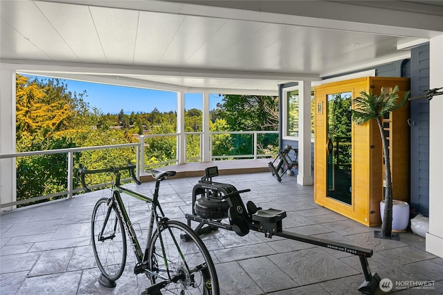7440 SE 32nd St, Mercer Island, WA 98040 - workout room with healthy amount of natural light and stone tile floors