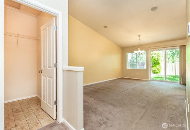 5513 Starlight St E, Fife, WA 98424 - carpeted spare room with baseboards, lofted ceiling, and a chandelier