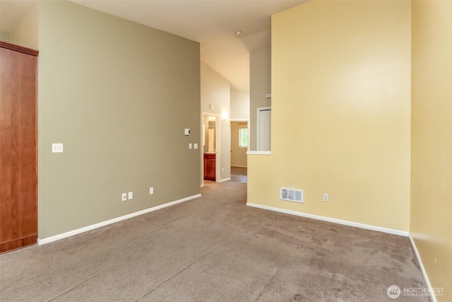 5513 Starlight St E, Fife, WA 98424 - carpeted spare room with baseboards and high vaulted ceiling