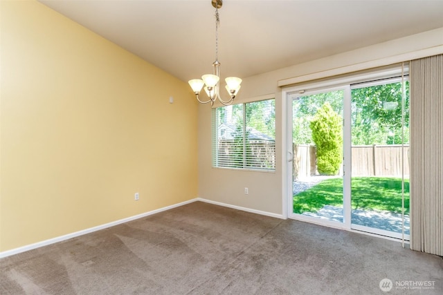 5513 Starlight St E, Fife, WA 98424 - spare room with a chandelier, carpet floors, baseboards, and lofted ceiling