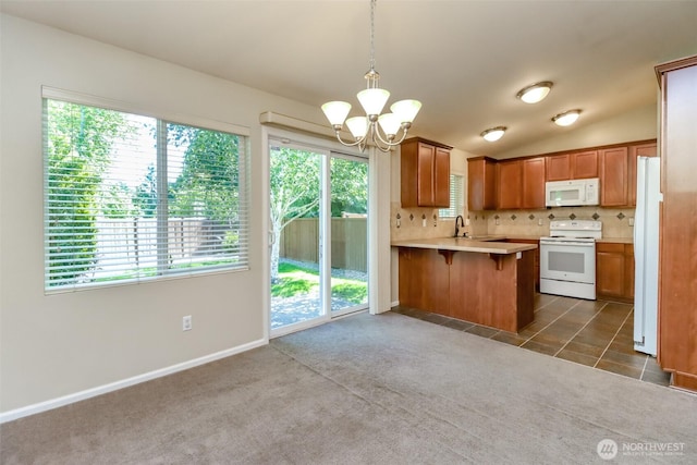 5513 Starlight St E, Fife, WA 98424 - kitchen featuring white appliances, a chandelier, a sink, light countertops, and a peninsula