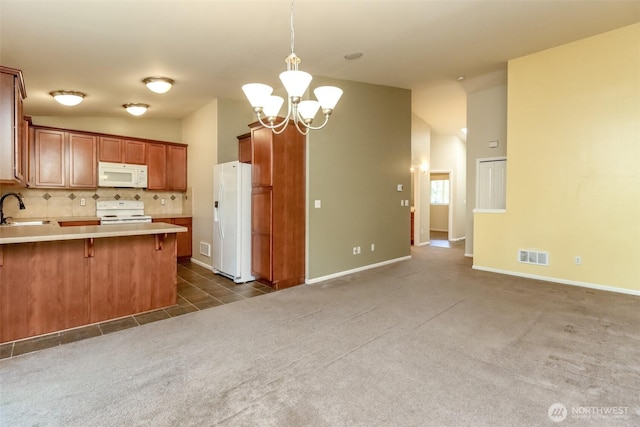5513 Starlight St E, Fife, WA 98424 - kitchen featuring white appliances, lofted ceiling, a sink, light countertops, and a chandelier