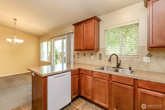 5513 Starlight St E, Fife, WA 98424 - kitchen featuring white dishwasher, a sink, light countertops, a peninsula, and lofted ceiling