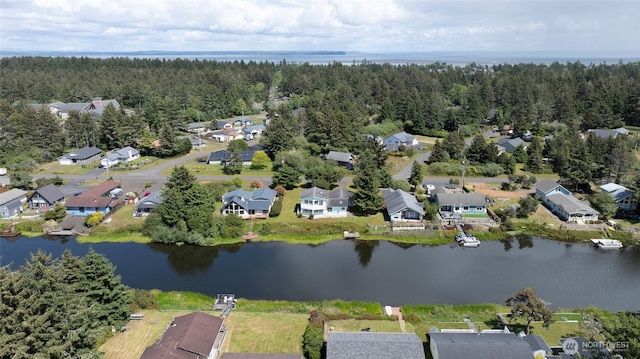 393 Canal Dr SE, Ocean Shores, WA 98569 - view of property location featuring a large body of water, nearby suburban area, and a forest