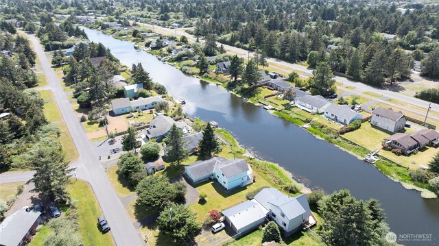 393 Canal Dr SE, Ocean Shores, WA 98569 - aerial overview of property's location with a nearby body of water and nearby suburban area