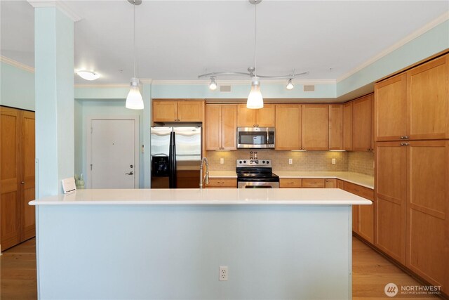 1501 Tacoma Ave S Unit 212, Tacoma, WA 98402 - kitchen featuring stainless steel appliances, crown molding, light wood-type flooring, light countertops, and decorative backsplash