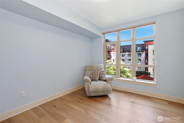 1501 Tacoma Ave S Unit 212, Tacoma, WA 98402 - living area with plenty of natural light, baseboards, and light wood-type flooring