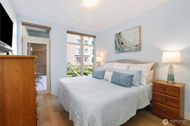 1501 Tacoma Ave S Unit 212, Tacoma, WA 98402 - bedroom with wood finished floors