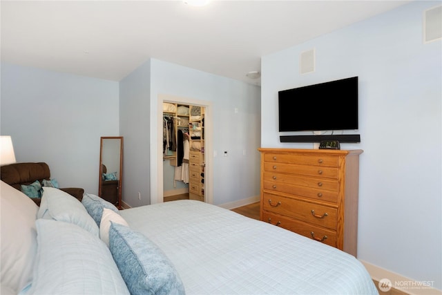 1501 Tacoma Ave S Unit 212, Tacoma, WA 98402 - bedroom featuring a spacious closet and baseboards