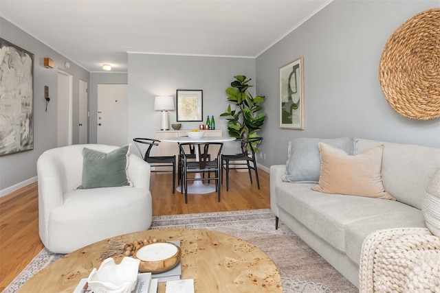 530 W Olympic Pl Unit 406, Seattle, WA 98119 - living room featuring wood finished floors, baseboards, and crown molding