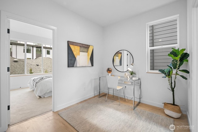 9019A 13th Ave NW, Seattle, WA 98117 - office area featuring wood finished floors and baseboards