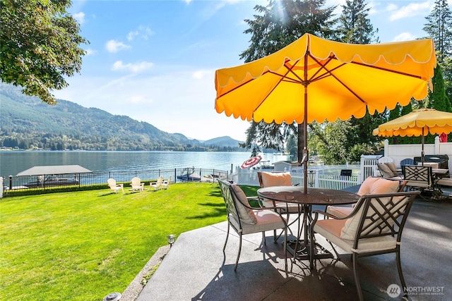 562 W Lake Samish Dr, Bellingham, WA 98229 - view of patio featuring outdoor dining space and a water and mountain view
