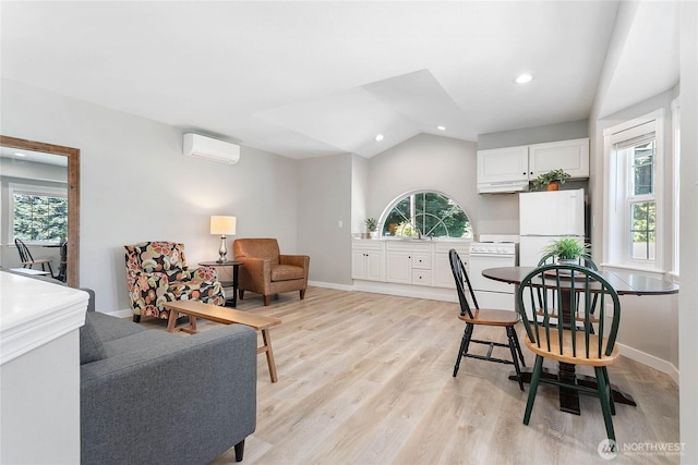 562 W Lake Samish Dr, Bellingham, WA 98229 - dining room featuring vaulted ceiling, a wall unit AC, light wood-style floors, baseboards, and recessed lighting