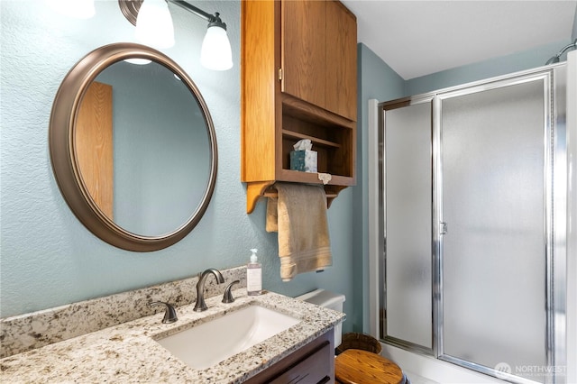 6822 168th St NE, Arlington, WA 98223 - bathroom with a shower stall, vanity, toilet, and a textured wall