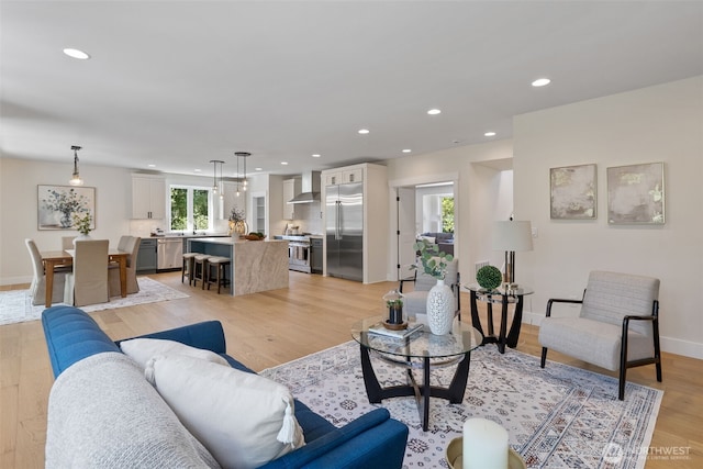 15001 NE 8th St, Bellevue, WA 98007 - living area with recessed lighting, light wood finished floors, and baseboards