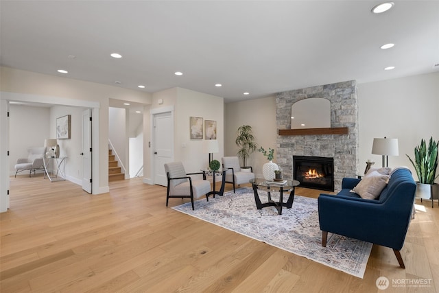 15001 NE 8th St, Bellevue, WA 98007 - living area featuring stairs, light wood-style floors, a fireplace, recessed lighting, and baseboards