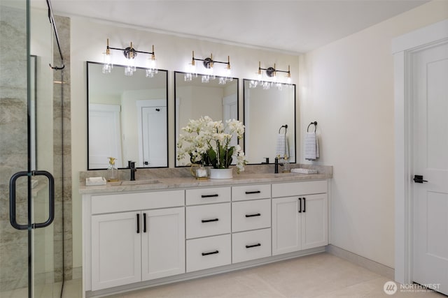 15001 NE 8th St, Bellevue, WA 98007 - full bath featuring double vanity, a stall shower, tile patterned flooring, and baseboards