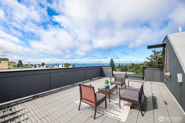 4517 44th Ave SW Unit B, Seattle, WA 98116 - view of patio / terrace featuring a water view and a balcony