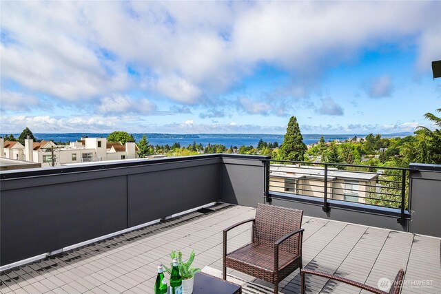 4517 44th Ave SW Unit B, Seattle, WA 98116 - view of patio with a balcony and a water view