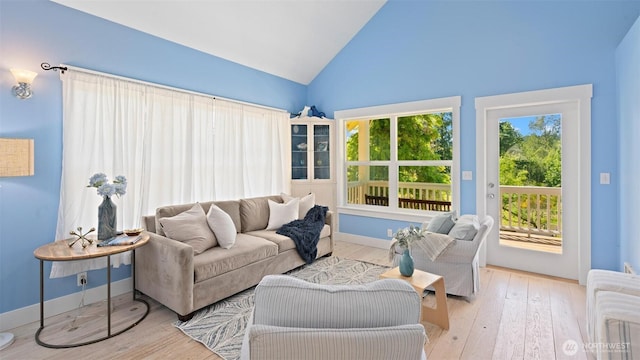 10539 N Madison Ave NE, Bainbridge Island, WA 98110 - living area with vaulted ceiling, wood-type flooring, and baseboards