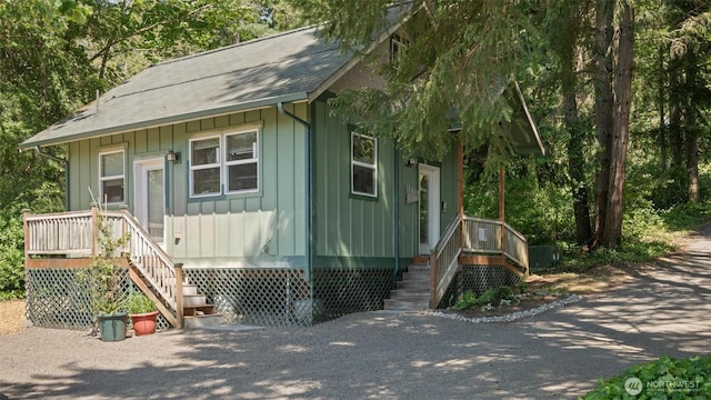 10539 N Madison Ave NE, Bainbridge Island, WA 98110 - view of front of property featuring board and batten siding, stairs, and a shingled roof