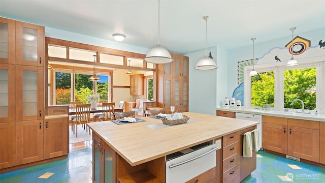 10539 N Madison Ave NE, Bainbridge Island, WA 98110 - kitchen featuring a warming drawer, a sink, butcher block countertops, and pendant lighting