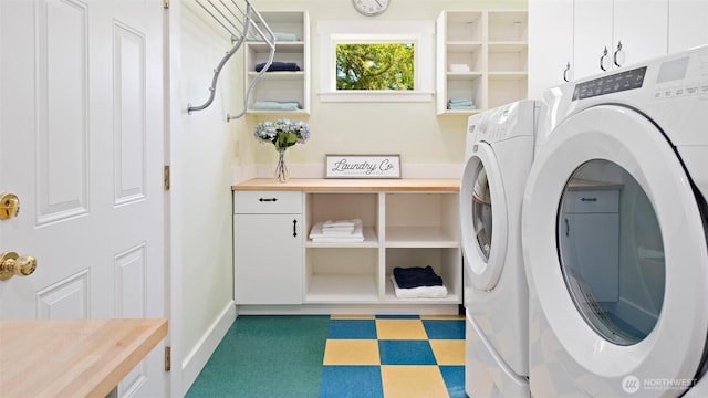 10539 N Madison Ave NE, Bainbridge Island, WA 98110 - washroom with washing machine and clothes dryer, tile patterned floors, cabinet space, and baseboards