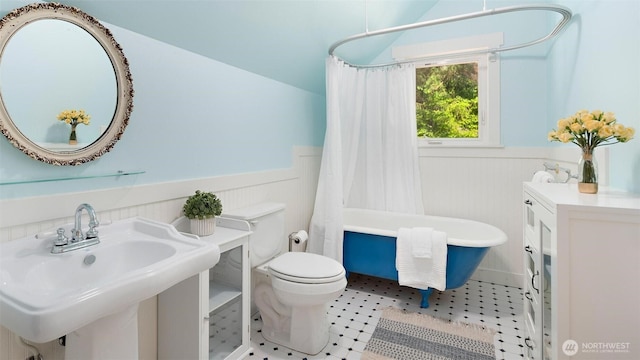 10539 N Madison Ave NE, Bainbridge Island, WA 98110 - bathroom with wainscoting, a sink, toilet, and shower / bath combination with curtain