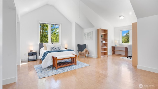 10539 N Madison Ave NE, Bainbridge Island, WA 98110 - bedroom with lofted ceiling, multiple windows, and baseboards
